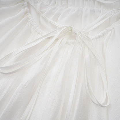 Quincie white shirred flounced mini dress