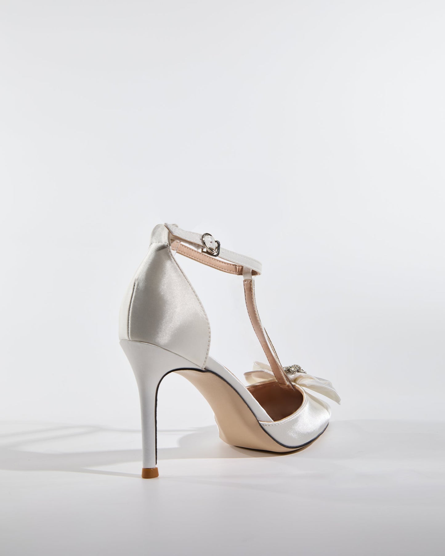 Zaina Bow Rhinestone T Strap Pumps In White