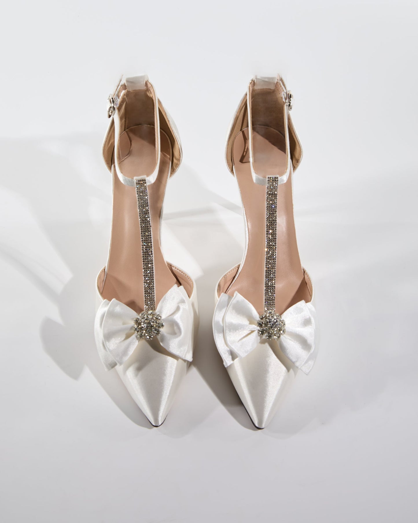 Zaina Bow Rhinestone T Strap Pumps In White